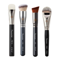 A Picasso Foundation Brush with soft bristles and a sleek handle.