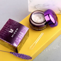 The product is designed to improve skin elasticity and reduce the appearance of fine lines and wrinkles around the eyes. The packaging is sleek and features the brand name and product details.